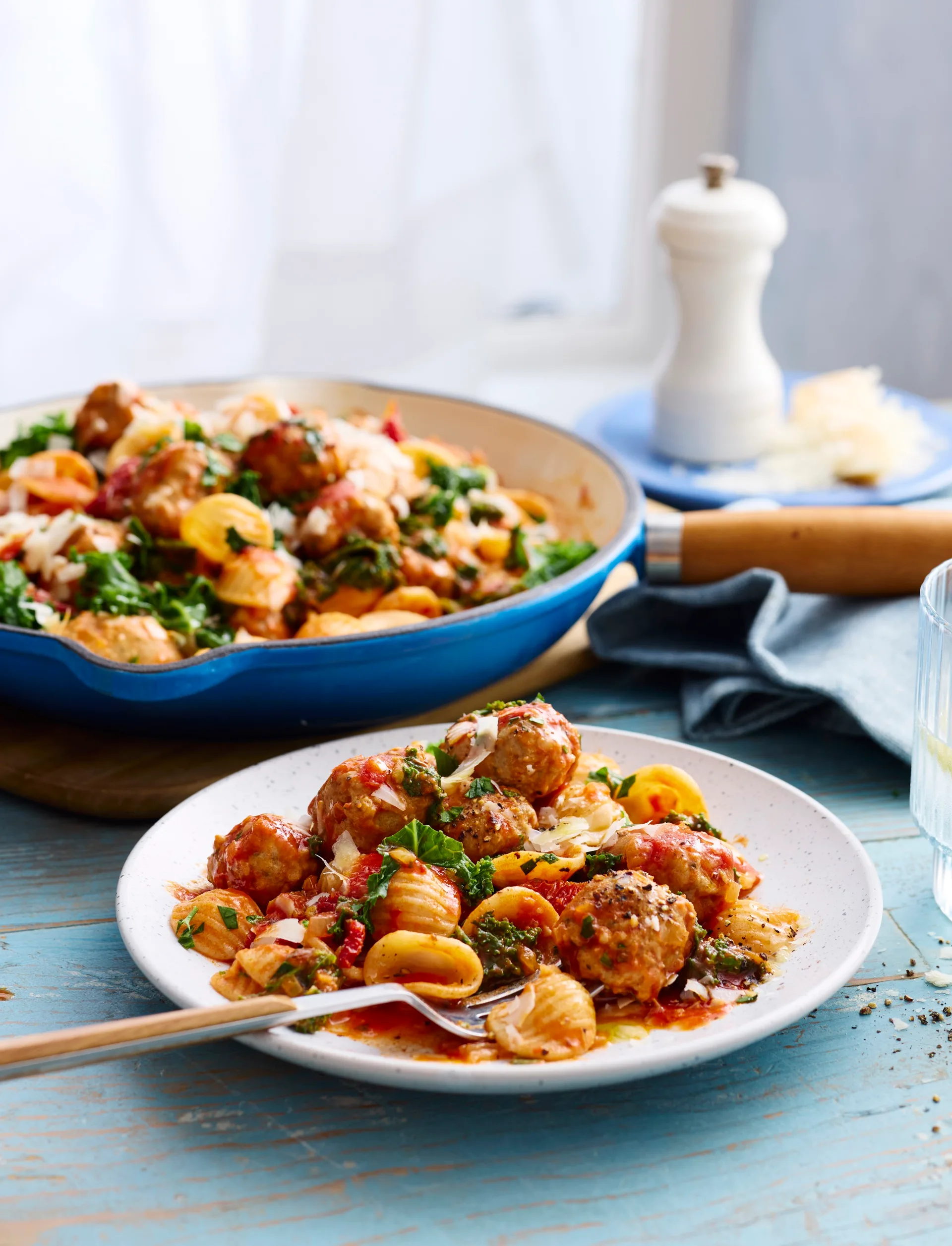 creamy sausage pasta with orecchiette pasta with fork coming out of bowl