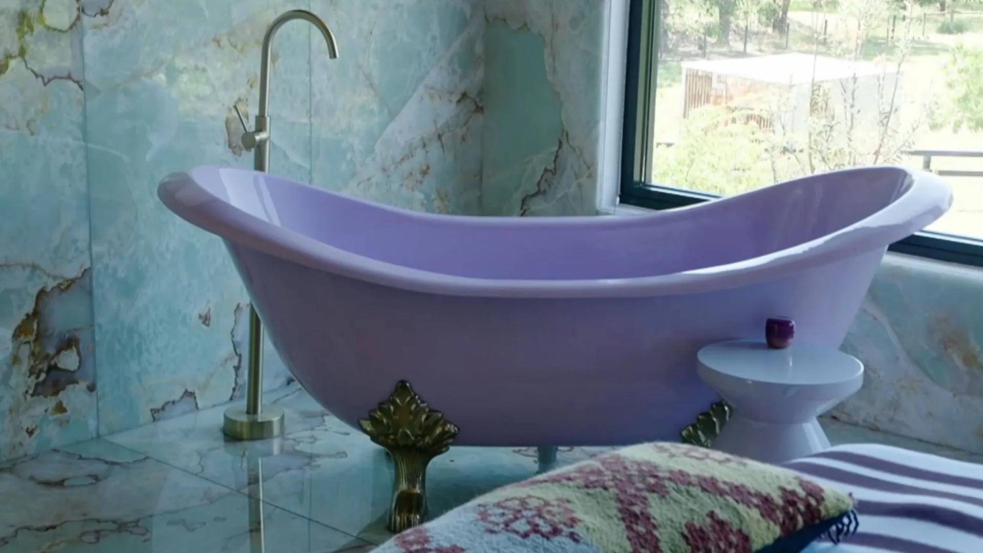 millie savage purple bathroom with green onyx tiles