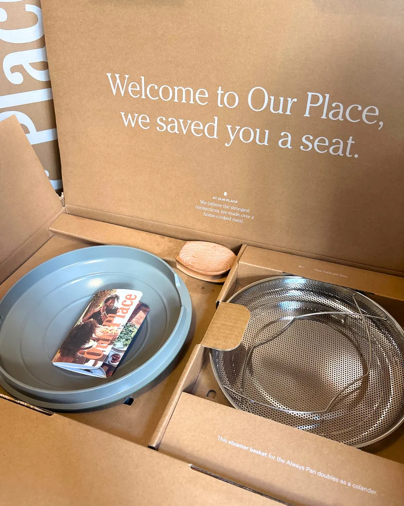 Unboxing of the Our Place Cookware Duo in Green, image shows the lid, instructions, and Colander