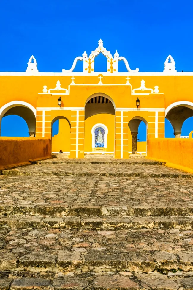 yellow city izamal in mexico with yellow painted monastery