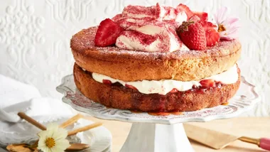 Sponge cake with jam and cream and berries