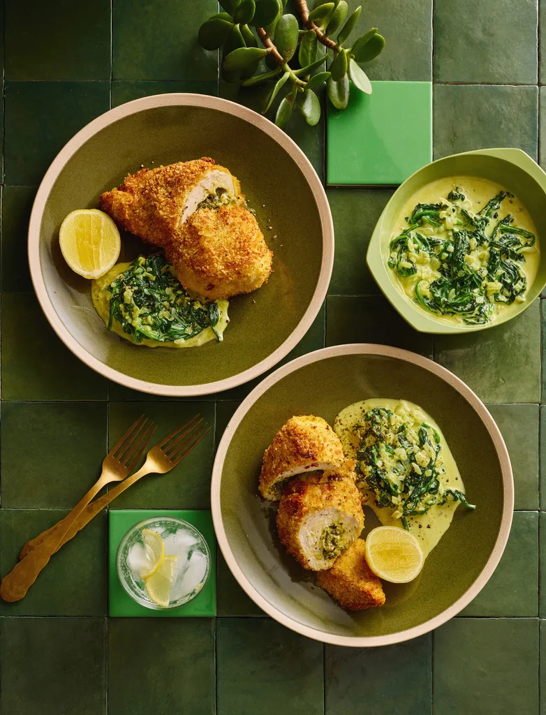 colin fassnidges homemade chicken kiev with kievs cut in cross section, herby salad and lemon wedge