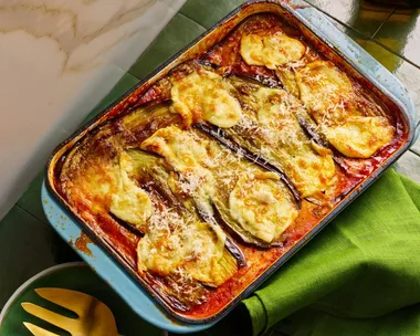 eggplant parmigiana with melted cheese in rectangular baking dish