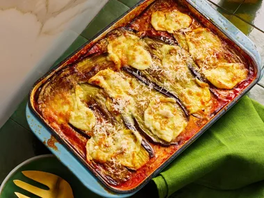 eggplant parmigiana with melted cheese in rectangular baking dish
