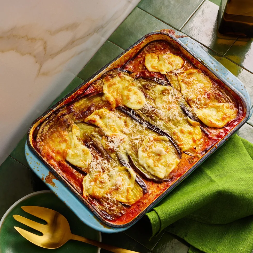 eggplant parmigiana with melted cheese in rectangular baking dish