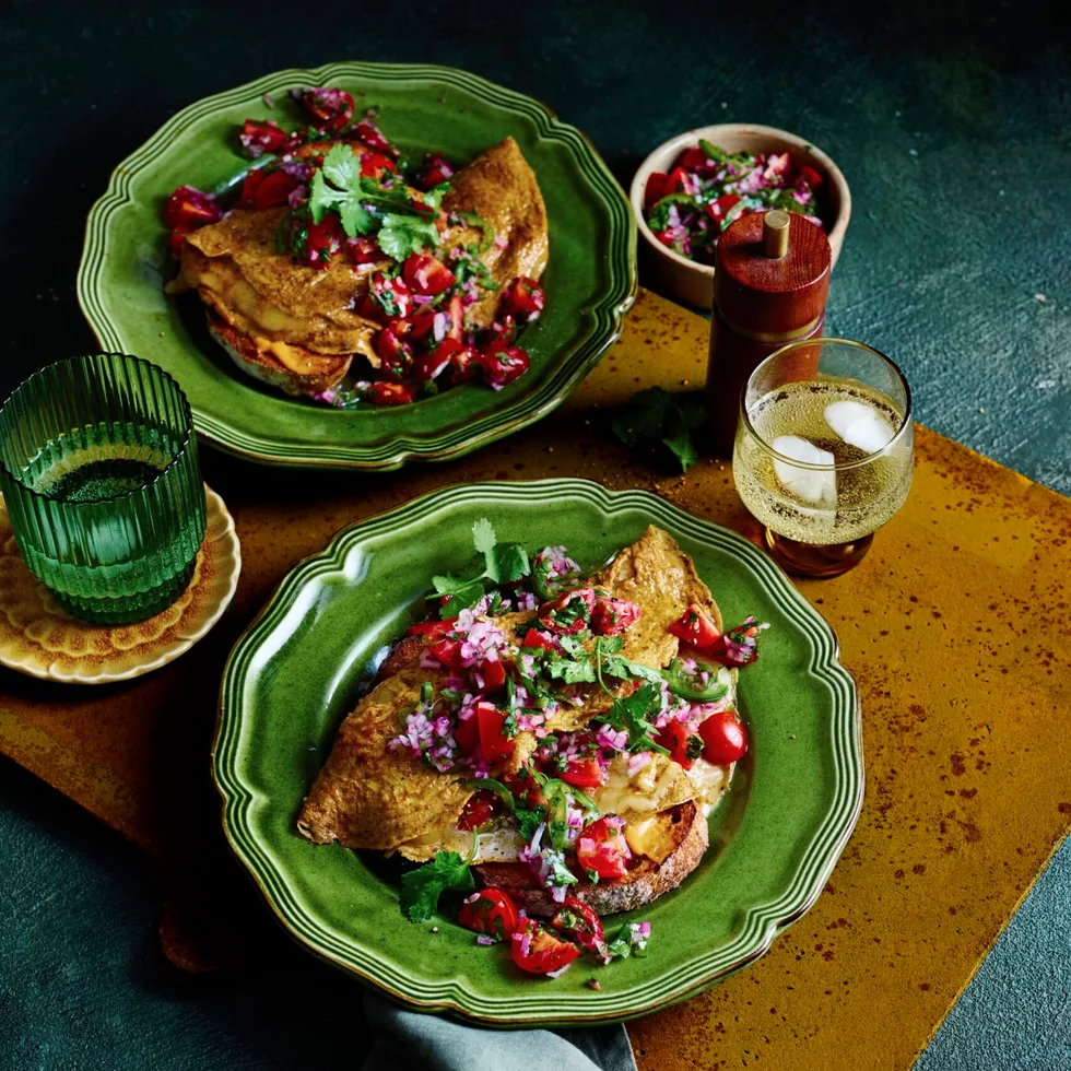 cherry tomato pico de gallo with mexican eggs in two green bowls