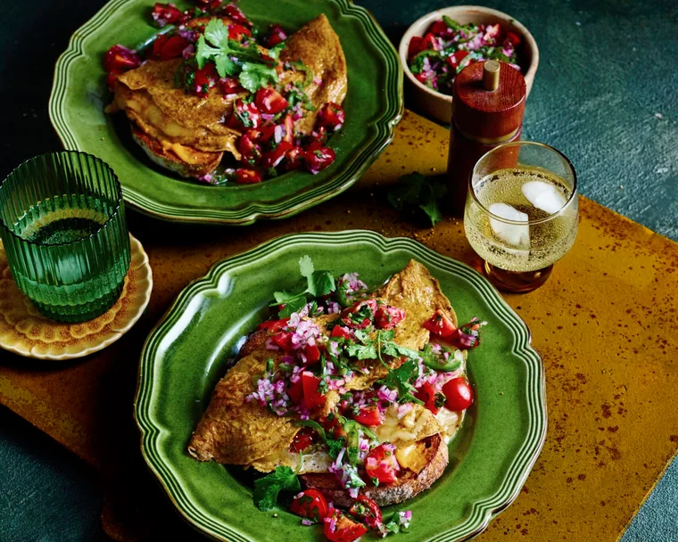 cherry tomato pico de gallo with mexican eggs in two green bowls