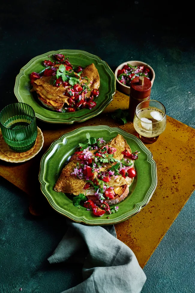 cherry tomato pico de gallo with mexican eggs in two green bowls
