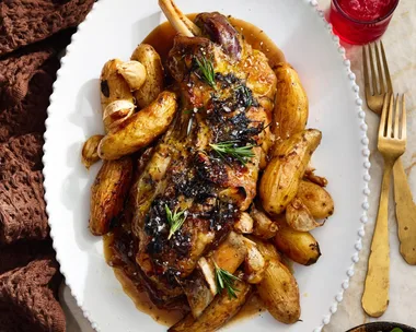 roast lamb with kipfler potatoes on oval plate