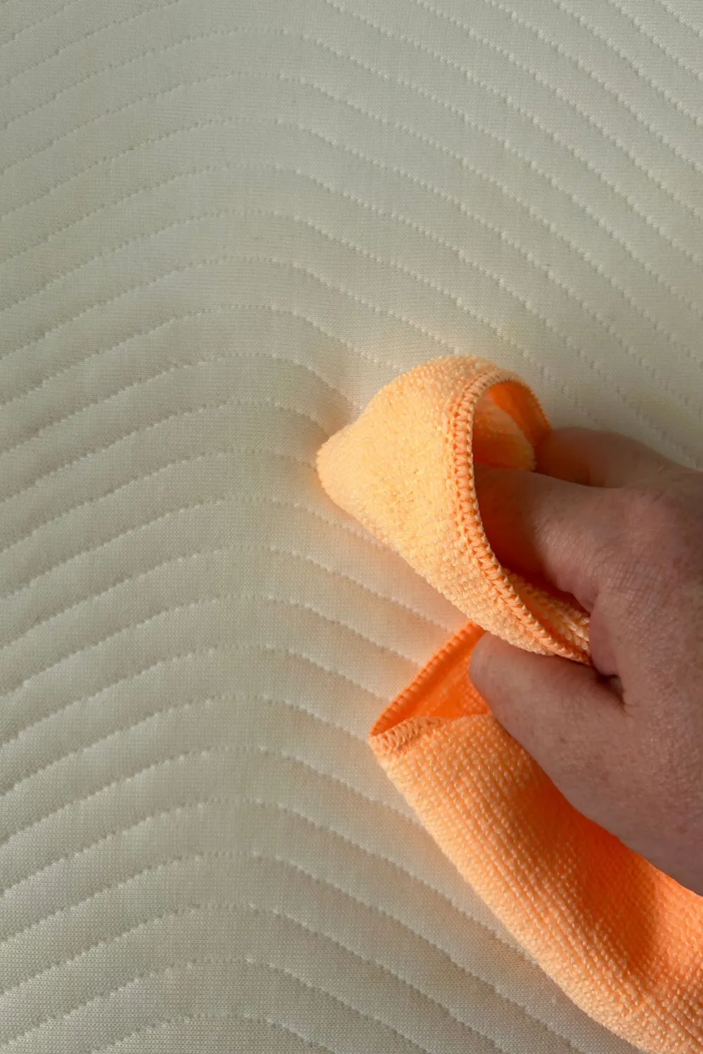 using a microfibre cloth to help lift the stain