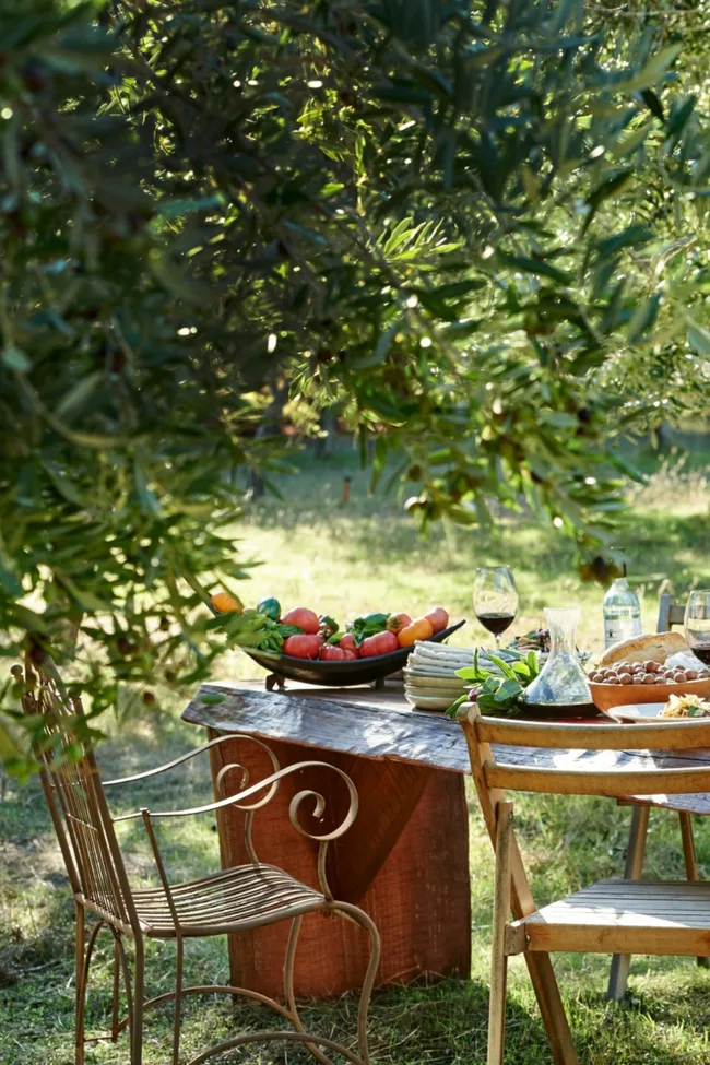 margaret river foodie destination with chairs at table and lots of food under tree
