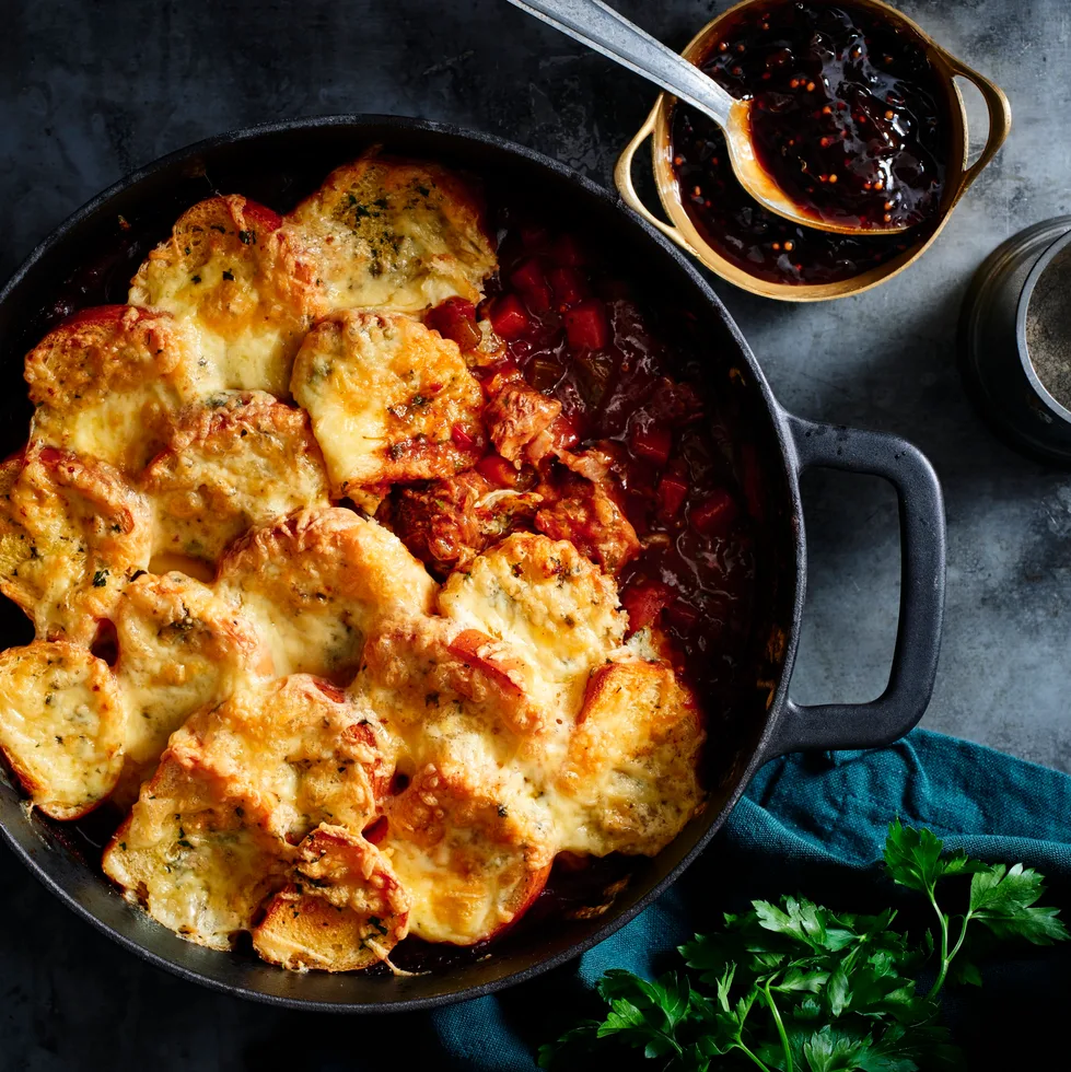 Chuck steak casserole with cheesy garlic bread topping