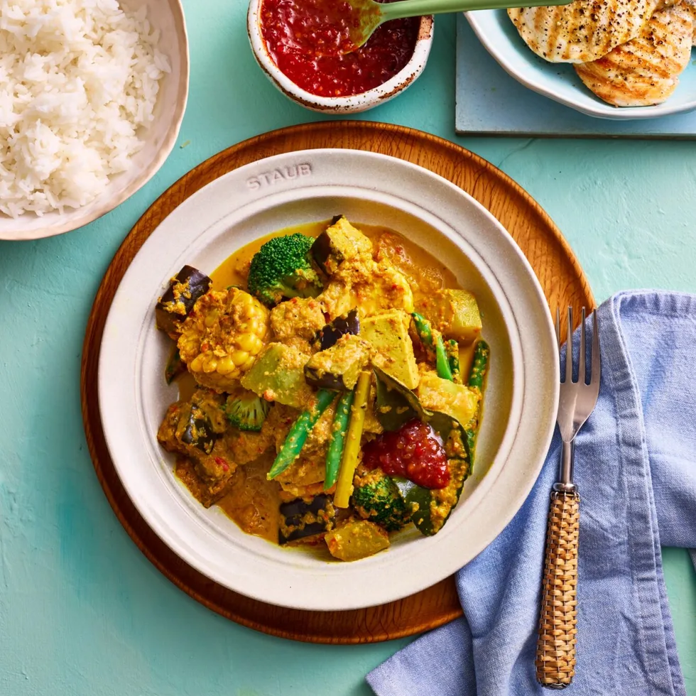 coconut vegetable stew from clarissa feidel with broccoli cabbage and an orange curry sauce