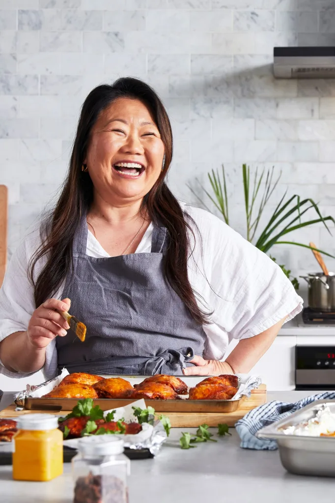 nagi maehashi laughing in apron as she prepares food