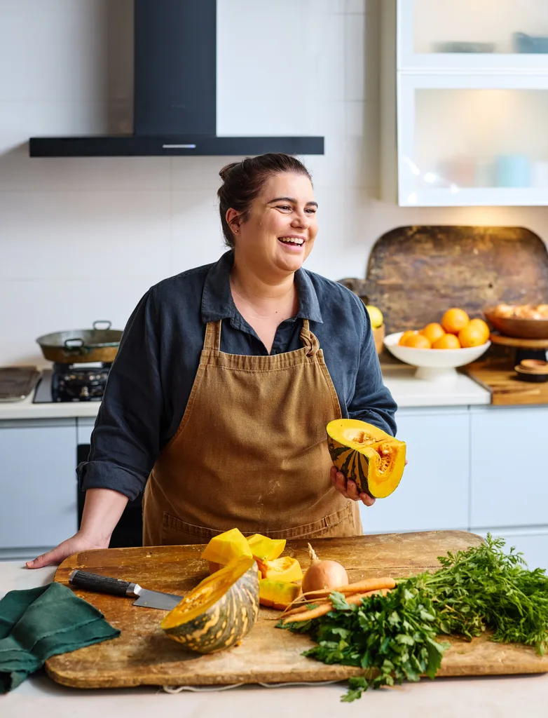 sarah murphy with cut up kent pumpkin for pumpkin soup on chopping board