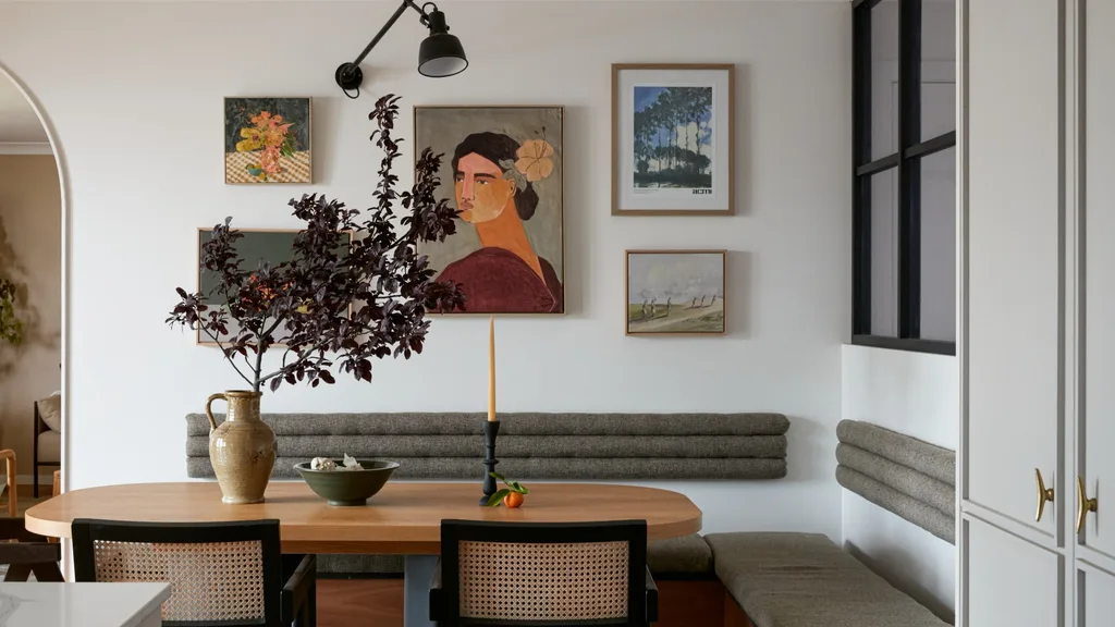 breakfast nook with banquette seating and rattan mid-centruy chairs with painted black frame