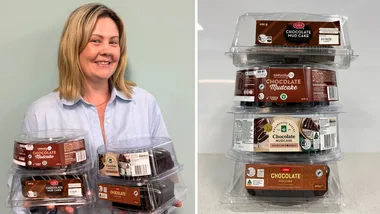 best supermarket mud cake in tower on right side in plastic packets and on left side a blonde woman holding 4 cakes aloft