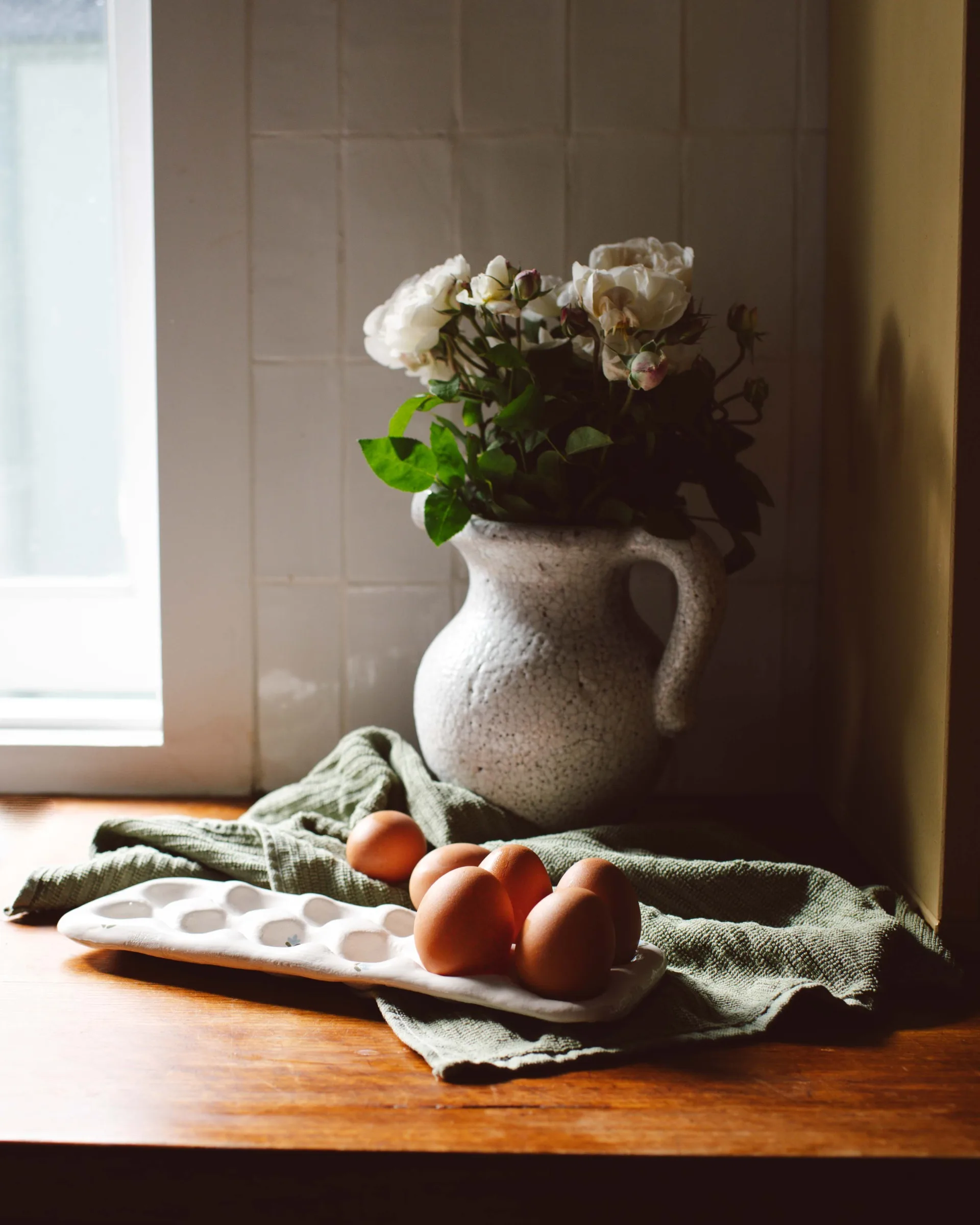 flower vase with white peonies and eggs in air dry clay egg holder