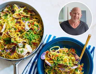 matt moran spaghetti with pipis in blue bowl with fork sticking out and parsley on top and pan of spaghetti on the side. circle pic of matt moran in the corner