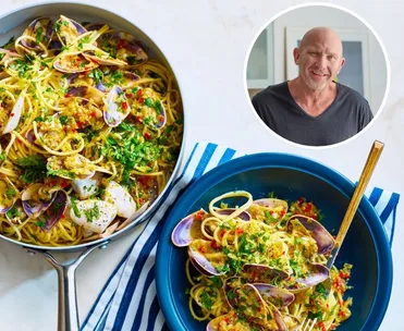 matt moran spaghetti with pipis in blue bowl with fork sticking out and parsley on top and pan of spaghetti on the side. circle pic of matt moran in the corner