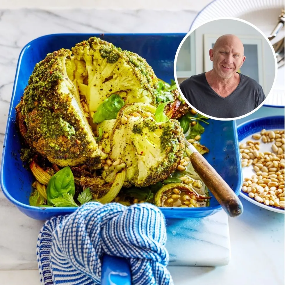 whole baked cauliflower with herby green butter on top, on a blue roasting dish with tea towel on handle. headshot of matt moran in circle in the corner