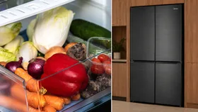 split image of crisper drawer filled with vegetables including carrot and capsicum and on the other side, a premium looking black, four door fridge