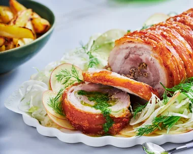 porchetta pork crackling rolled with herbs and slaw underneath