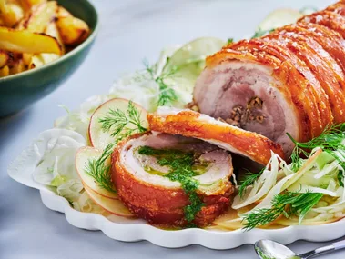 porchetta pork crackling rolled with herbs and slaw underneath