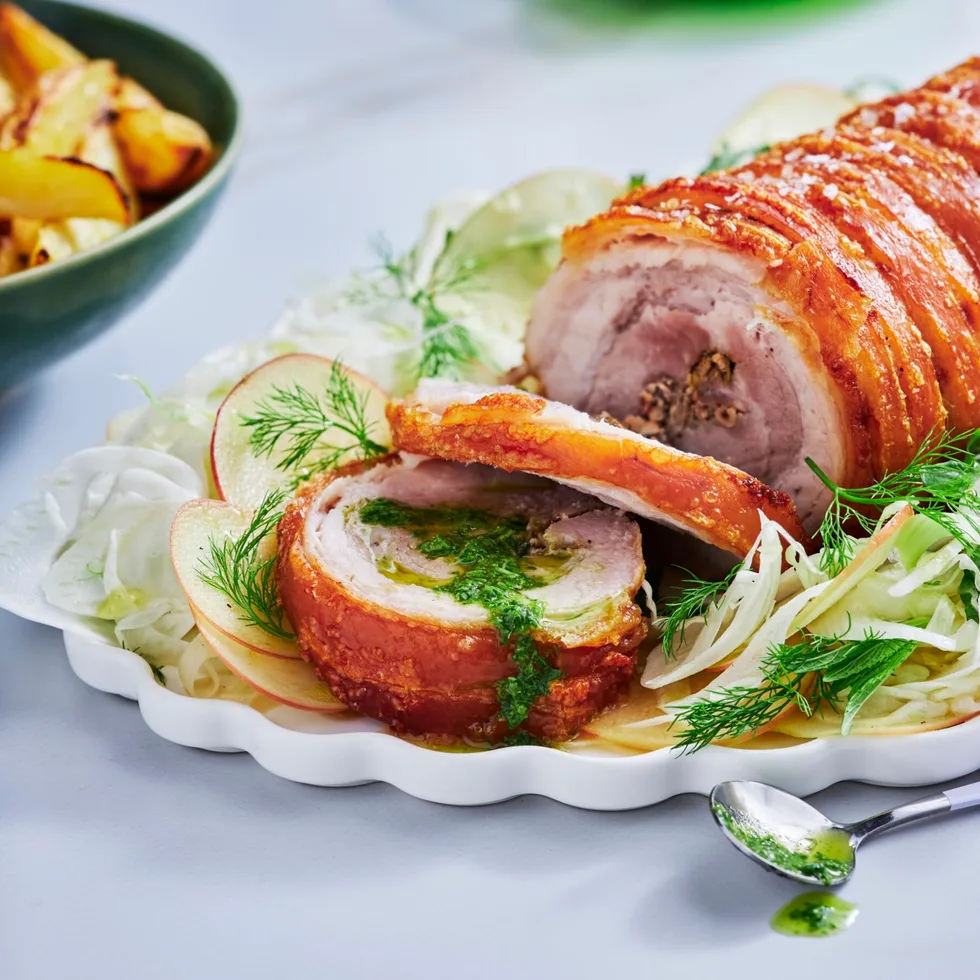 porchetta pork crackling rolled with herbs and slaw underneath