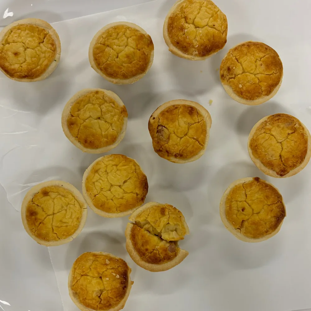 elmsbury party quiches spread out over a white tray