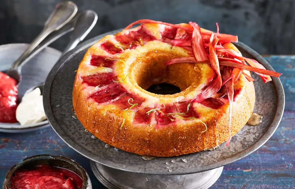 rhubarb recipe with lime a coconut with strips of rhubarb on top and a bundt cake form