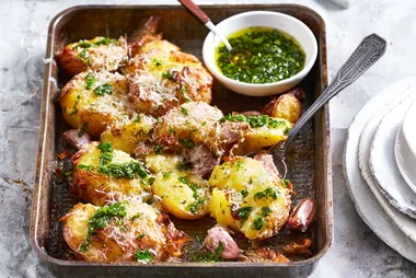 Smashed parmesan potatoes with herb oil