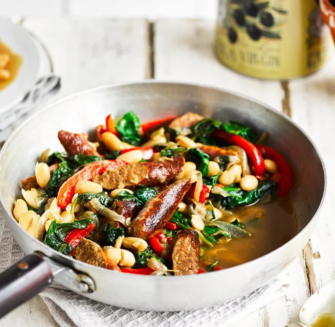 Beef sausages served with cannellini beans and vegetables