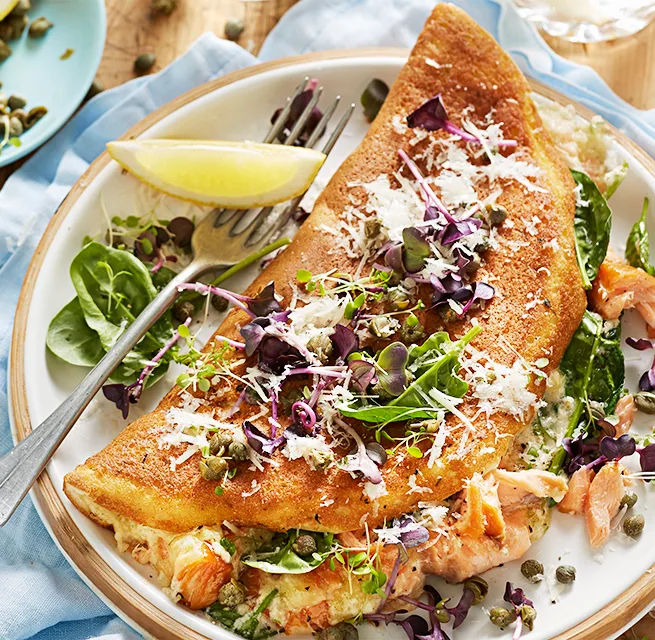 Souffle omellette with smoked salmon, capers, lemon and rocket