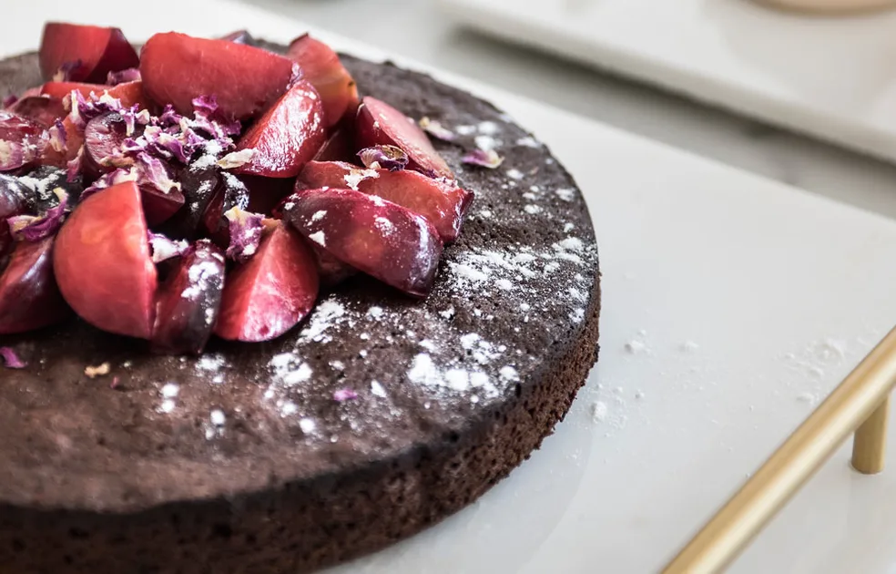 Chocolate cake with stewed plums Recipe | Better Homes & Gardens Australia