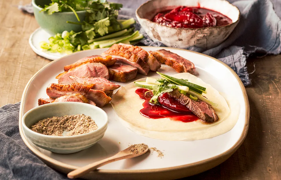 Seared duck with roasted plum relish and pancakes Recipe | Better Homes & Gardens Australia