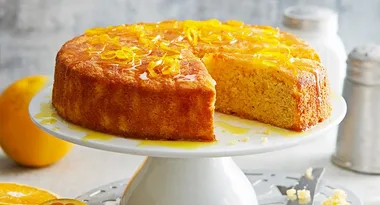 orange almond cake on cake stand