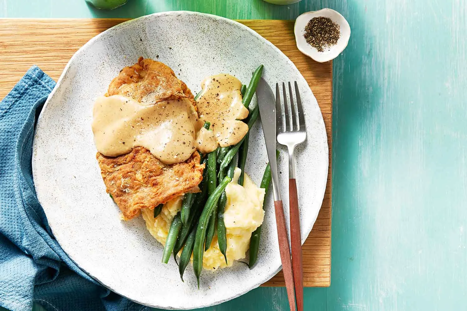 Chicken fried streak with cheese gravy