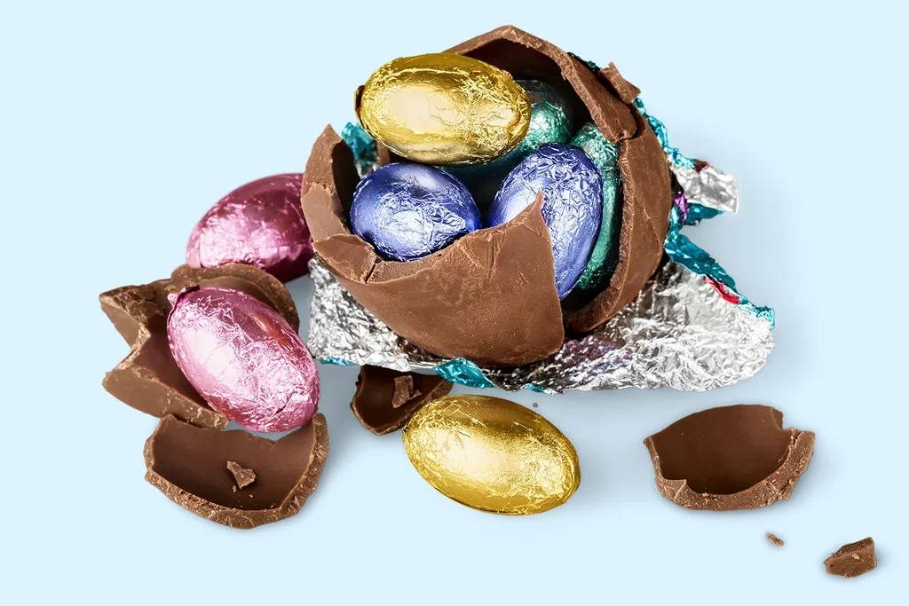 Easter egg cracked open with smaller eggs inside
