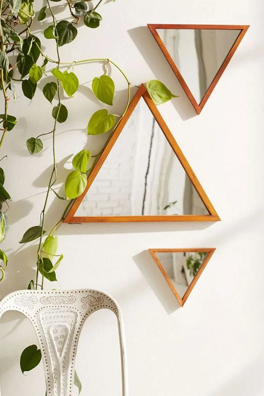 Triangle mirrors on wall