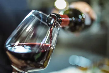 Resurrect a spoiled bottle of wine with this magic coin trick