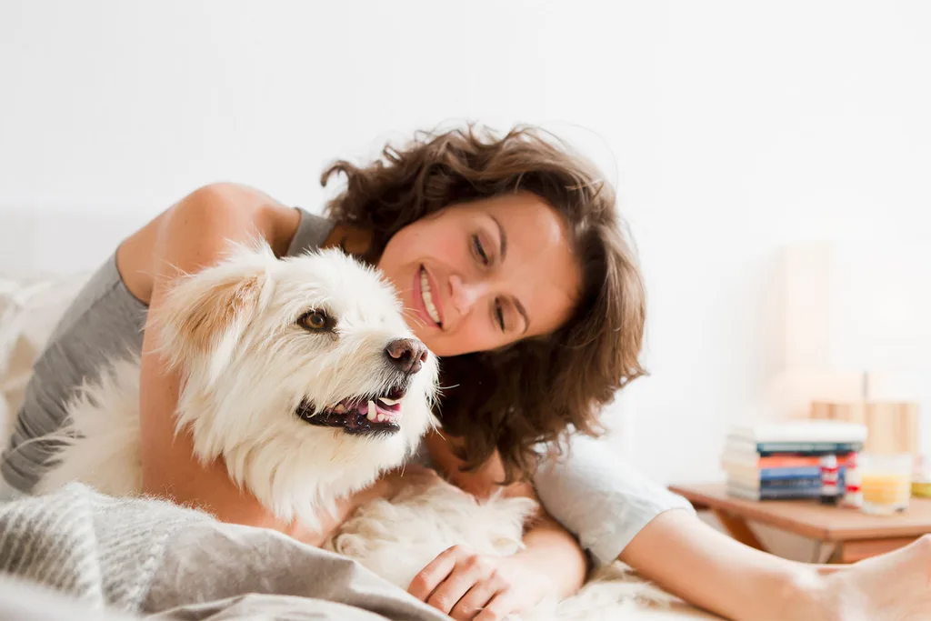 Woman hugging dog