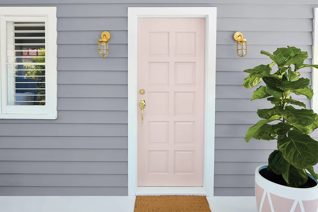 Grey house with pale pink front door