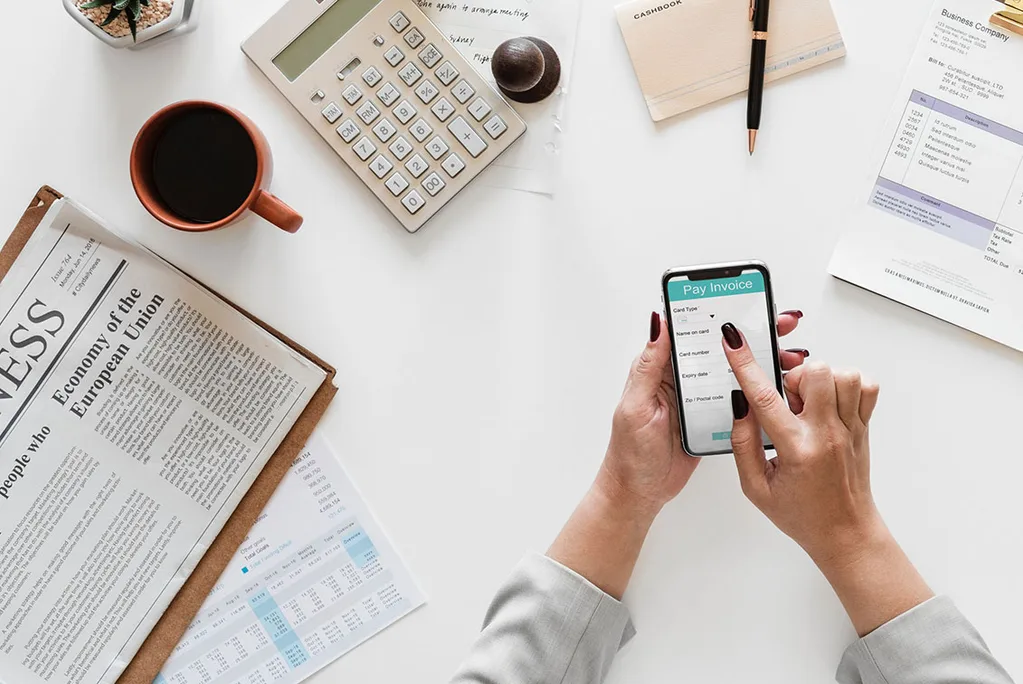 calculator with phone and paperwork