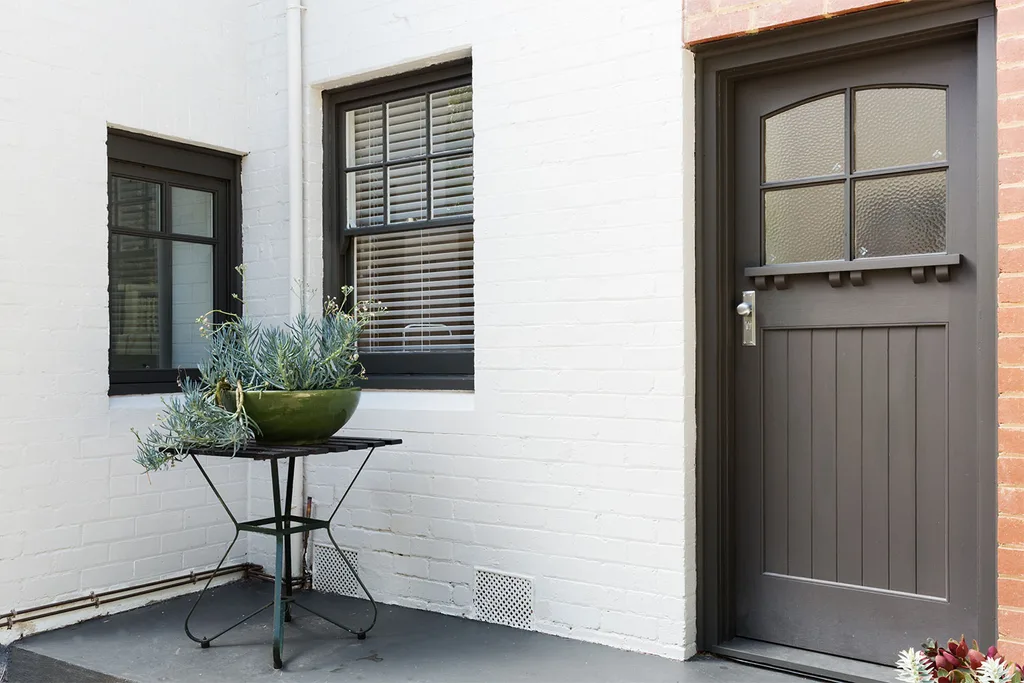 Exterior of painted white brick home