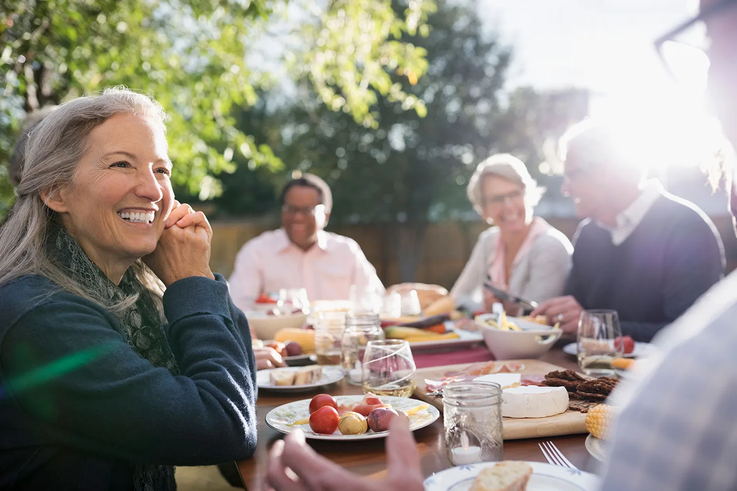 people having dinner and smiling