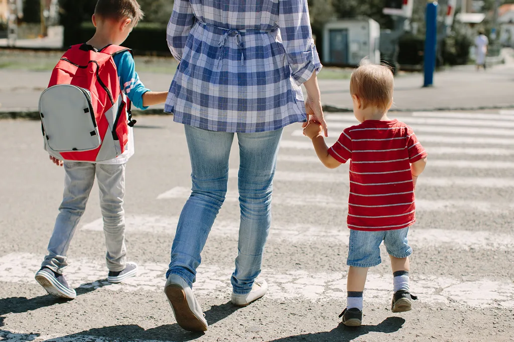 family crossing road