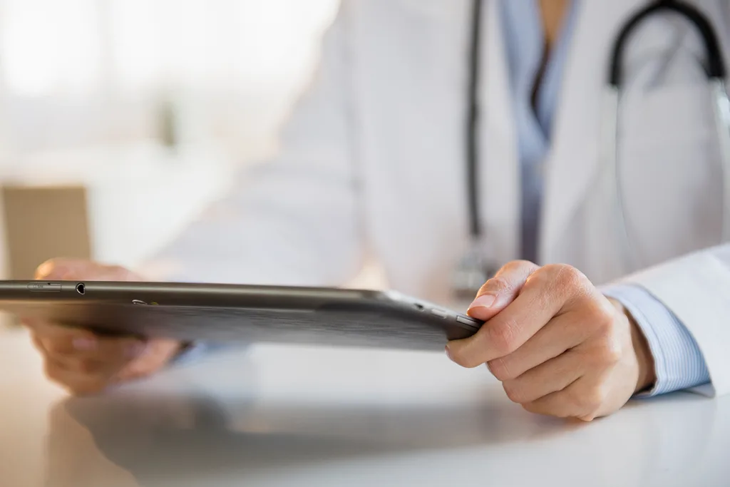 doctor holding an ipad
