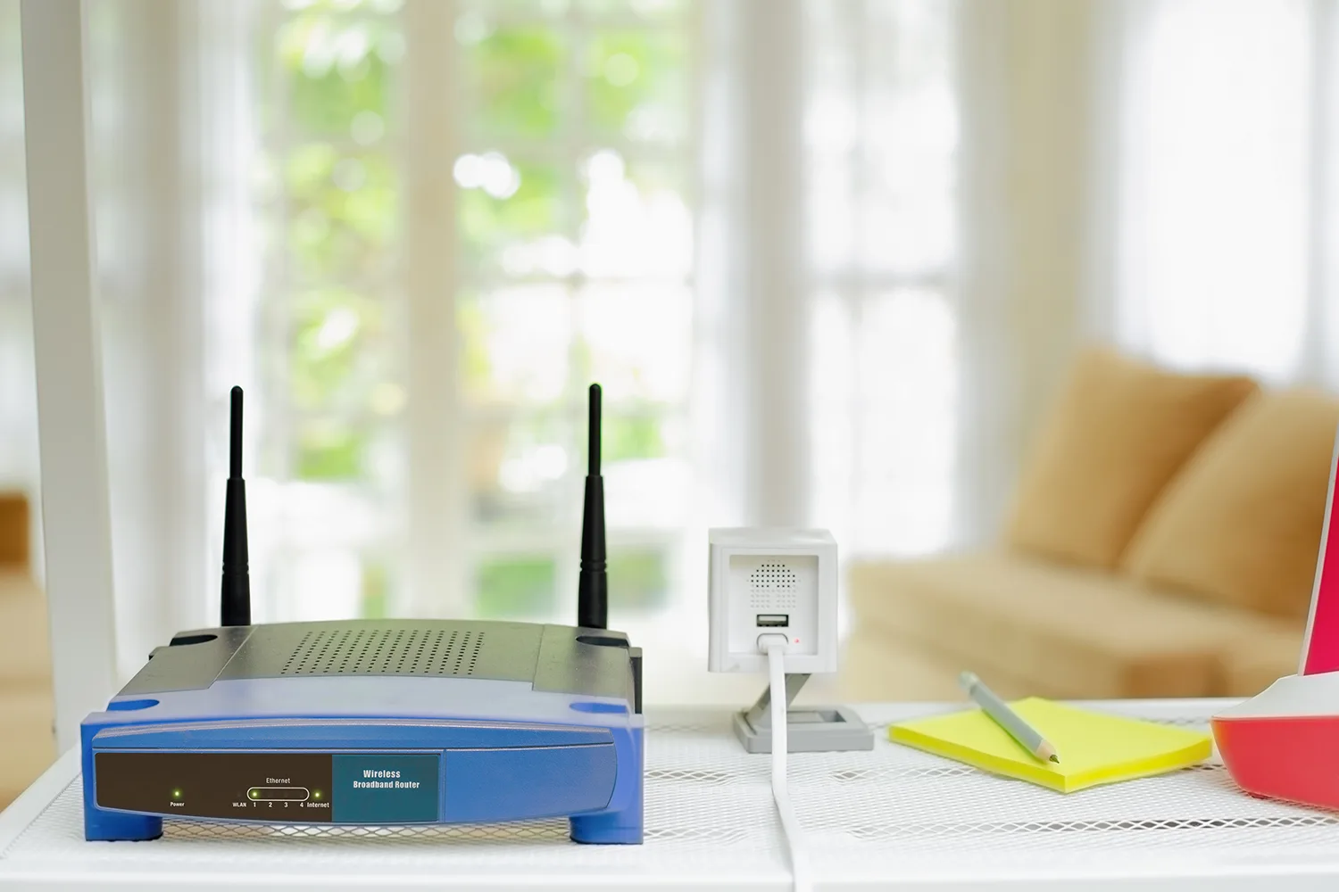 internet modem and wireless camera on bench