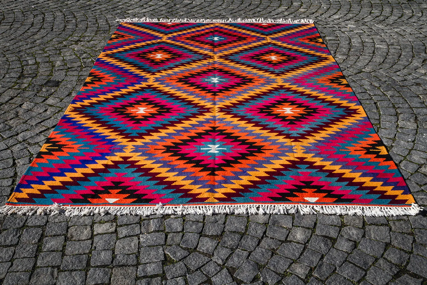 Kilim rug on cobble stone street